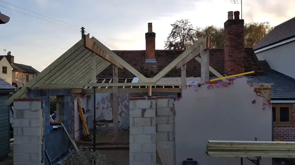 New roof timbers going up on blockwork walls during a B UK Property Services build in Essex